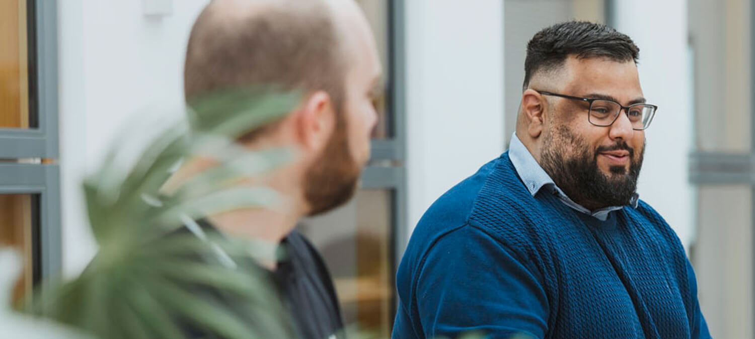 CAD21 engineer in professional setting, representing the team culture and working environment