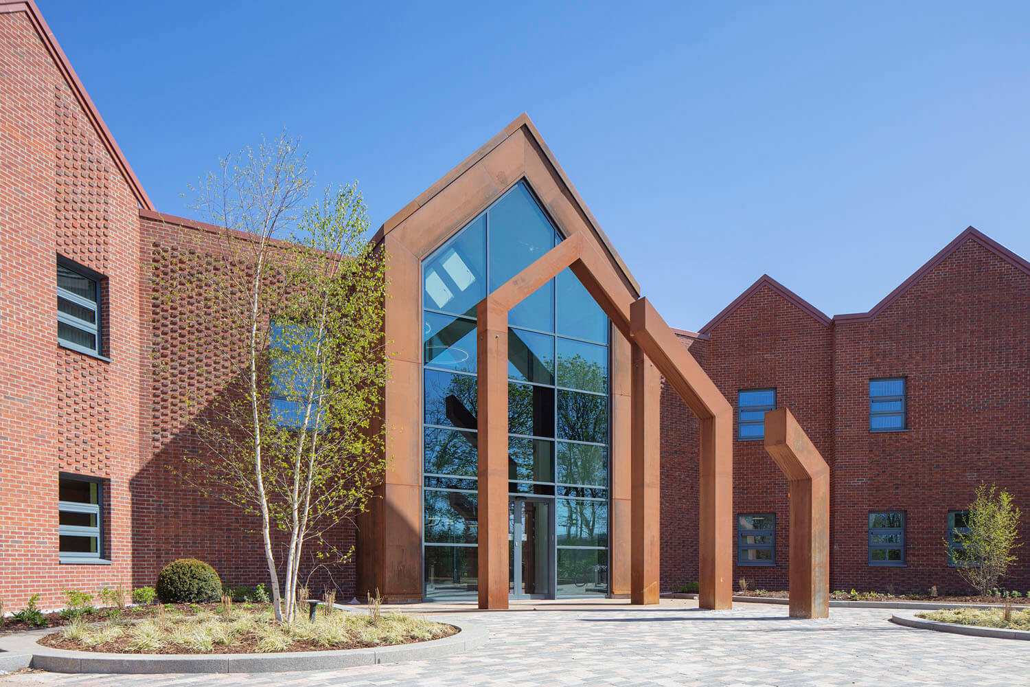 Foss Park Hospital's red-brick frontage and glazed gabled entrance, York MEP design by CAD21