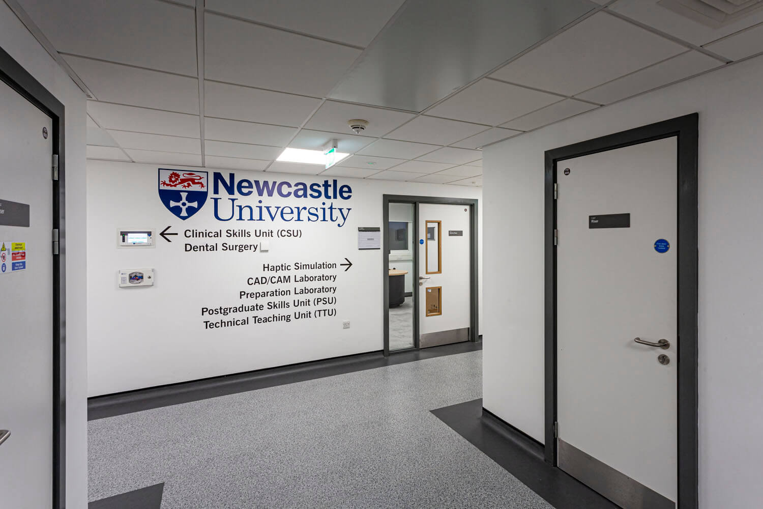 The dental school entrance with Newcastle University branding on Level 7 of the Dental Hospital