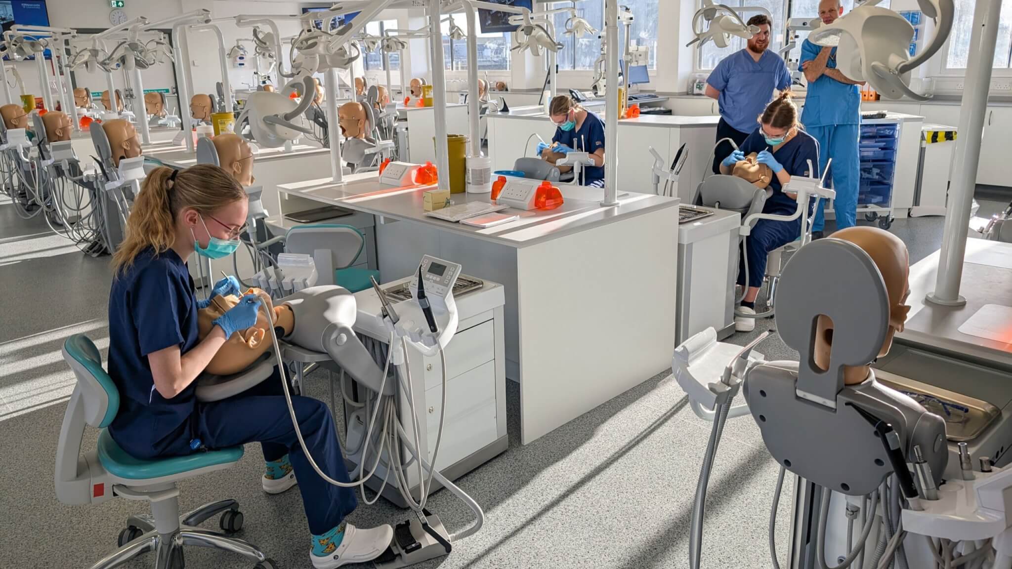 Students working at the dental simulation bays, the finished training suite in use on Level 7